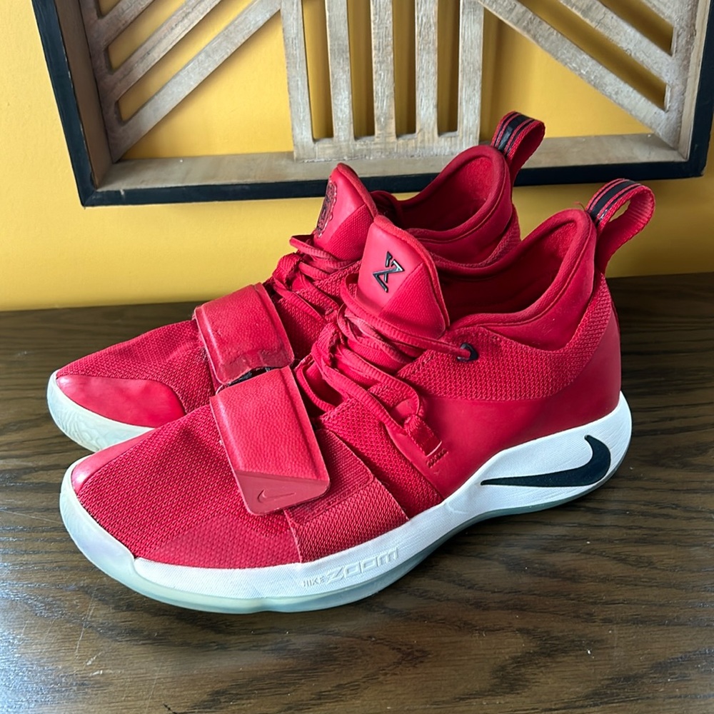 Nike zoom Paul George basketball shoe. Red shoe with white sole, black detail.